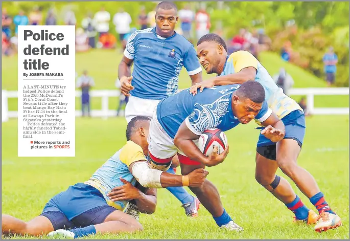  ?? Picture: JONA KONATACI ?? Police forward Joni Tanoa charges forward against Ratu Filise during the final of the McDonald’s Fiji’s Coral Coast Sevens at Lawaqa Park in Sigatoka yesterday.