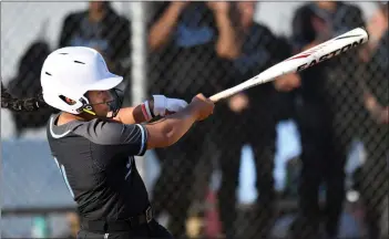  ?? PHOTO BY MILKA SOKO ?? Norco’s Kynarra Vuki hits a home run against Corona during the fifth inning of Friday’s Big VIII League victory