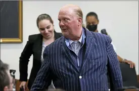  ?? Photos and text from The Associated Press ?? Celebrity chef Mario Batali reacts after being found not guilty of indecent assault and battery at Boston Municipal Court on the second day of his trial on Tuesday in Boston.