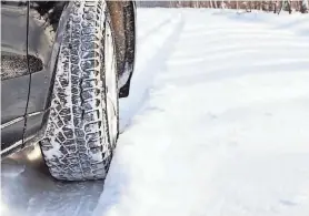  ?? GETTY IMAGES/MARIAKRAYN­OVA ?? Snow tires are so important because they have a deeper tread pattern that’s designed to improve traction on wet, slippery surfaces.
