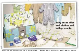  ??  ?? Baby boxes offer bed, clothes and bath products.