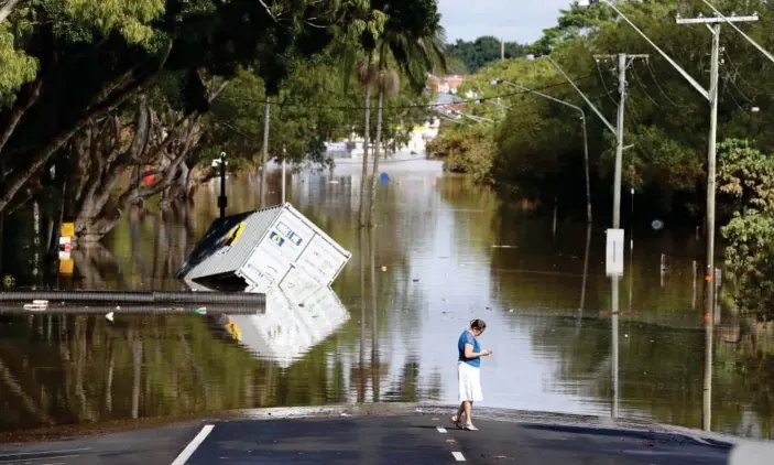  ?? Photograph: Jason O'Brien/AAP ?? Flooded streets in New South Wales, Australia, last month.