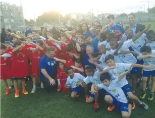  ?? (Eliyahu Kamisher) ?? STUDENTS IN THE Equalizer program pose for a photo before a soccer tournament in Jaffa on Tuesday.