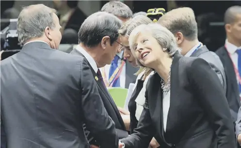  ?? PICTURE: AFP/GETTY IMAGES ?? 0 Theresa May greets Swedish Prime Minister Stefan Loefven during the EU leaders summit in Brussels