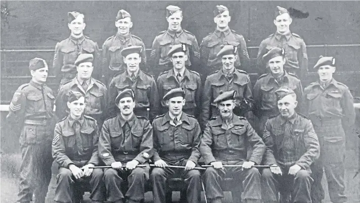  ??  ?? Above: Thomas Patrick in a regiment photograph – he is in the centre of the back row.