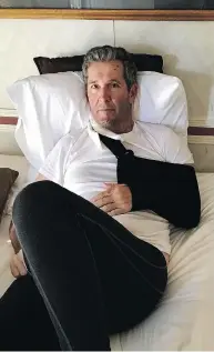  ??  ?? Manitoba Premier Brian Pallister rests after breaking his arm during a fall while hiking in New Mexico.