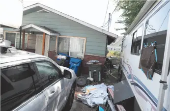  ?? AP PHOTO ?? Vehicles are parked Wednesday outside the home of Paige A. Thompson, who uses the online handle “erratic.”