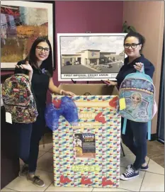  ??  ?? Gabby Castanon and Gracie Bueno of FICU with the first donation for the Backpack and School Supplies Drive at the First Imperial Credit Union Calexico Branch. COURTESY PHOTO