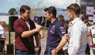  ??  ?? Red Bull TV hosts Cyril Despres, Mike Chen, Matthew Wilson at the podium ceremony of the FIA World Rally Championsh­ip 2017, Stop 4 in Corsica, France.