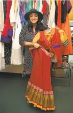  ??  ?? Anisha Nagarajan, who plays Alice in the show, shows her costume designed by Bhasin for the show opening May 19 at Berkeley Rep.