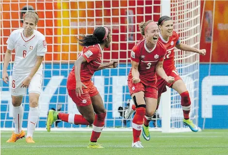  ?? MARK VAN MANEN/POSTMEDIA NEWS ?? Josee Belanger, second from right, celebrates Sunday after Canada’s 1-0 win over Switzerlan­d at the Women’s World Cup.
