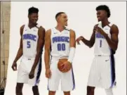  ?? JOHN RAOUX — THE ASSOCIATED PRESS ?? Orlando Magic’s Mohamed Bamba (5), Aaron Gordon (00) and Jonathan Isaac (1) joke around before posing for a photo at the team practice facility for the NBA basketball team media day Monday in Orlando, Fla.