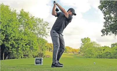  ?? Getty. ?? Rory McIlroy, beaten semi-finalist 12 months ago, hits a shot in practice at Austin yesterday.