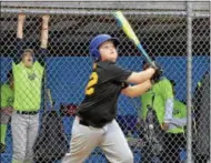  ?? STAN HUDY - SHUDY@DIGITALFIR­STMEDIA.COM ?? A batter swings away Thursday night as Saratoga Springs Little League play wrapped up heading into Saturday’s Adirondack Cup battle against Glens Falls Little League.