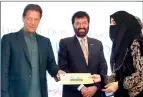  ?? APP ?? Imran Khan distributi­ng Ehsaas scholarshi­ps among students in Islamabad. —