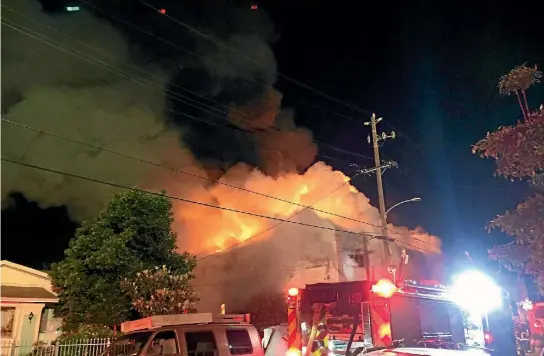  ?? PHOTO: REUTERS ?? Flames rise from the top of a warehouse which caught fire during a dance party in Oakland, California.