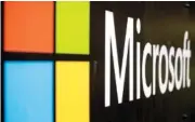  ?? AP PHOTO/RICK RYCROFT ?? The Microsoft company logo is displayed in 2021 at their offices in Sydney, Australia.