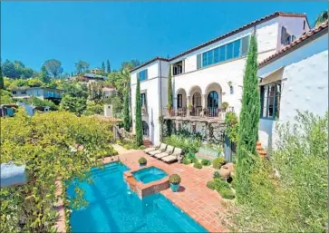  ?? Michael McNamara Shooting LA ?? THIS ITALIANATE-STYLE house in Los Feliz was purchased by voice actor/TV host/comedian Chris Hardwick and actress Lydia Hearst for $11 million. The home was designed in 1928 by architect Paul Williams.