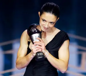  ?? — AFP photo ?? Bonmati receives The Best FIFA Women’s Player award during the Best FIFA Football Awards 2023 ceremony in London.