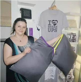  ?? PHOTOS: PETER O’NEIL/POSTMEDIA NEWS ?? A couple’s pillow — which can easily be separated in two by a zipper — is available in the gift shop at the Museum of Broken Relationsh­ips in Croatia.