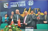  ?? PROVIDED TO CHINA DAILY ?? Liugong Machinery Corp finalizes its acquisitio­n of Polandhead­quartered manufactur­er Huta Stalowa Wola’s civil constructi­on machinery business section in 2012.