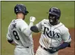  ?? CHRIS O’MEARA - THE ASSOCIATED PRESS ?? Tampa Bay Rays’ Randy Arozarena celebrates his solo home run off New York Yankees starting pitcher Domingo German with second baseman Brandon Lowe (8) during the third inning of a baseball game Saturday, April 10, 2021, in St. Petersburg, Fla.