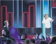  ??  ?? Charlie Puth, left, and Wiz Khalifa perform at the Kids’ Choice Awards.