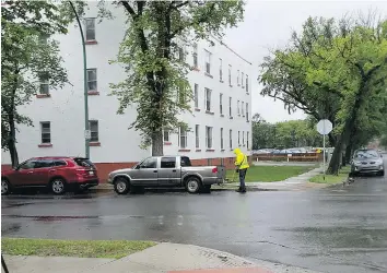  ??  ?? Dawn Ridgway took this photo on June 14 while a Regina parking enforcemen­t officer measured a truck’s distance from the corner before issuing a ticket at the intersecti­on of 14th Avenue and Halifax Street.