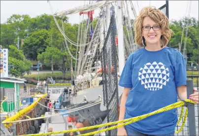  ?? NIKKI SULLIVAN/CAPE BRETON POST ?? Nicole MacAulay, spokeswoma­n for the Port of Sydney Developmen­t Corp., stands in front of the tall ship Lord Nelson on Sunday. An estimated 15,000 people attended the Rendez-Vous 2017 Tall Ships Regatta in Sydney and Louisbourg.