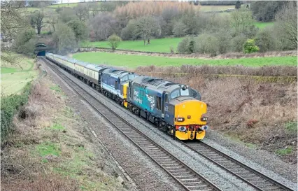  ?? CHRIS MILNER ?? The penultimat­e use of DRS Class 37s on a Pathfinder Railtour was on March 12 when No. 37218 and No. 37425 Sir Robert McAlpine / Concrete Bob hauled the ‘Pennine Wayfarer’ from Bristol to Bolton via the Hope Valley, Calder Valley and Diggle routes. The train is seen at Milford, Derbyshire, having just emerged from the 855 yard tunnel heading towards Belper.