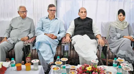  ??  ?? UNION HOME MINISTER Rajnath Singh and Chief Minister Mehbooba Mufti during an iftar party on the banks of Dal Lake in Srinagar on June 7. Governor N.N. Vohra and former Chief Minister Omar Abdullah are also present.