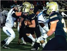  ?? TIM GODBEE / For the Calhoun Times ?? Calhoun’s Jess Ralston (center) cuts through the Cedar Grove defense for yardage during last Friday’s game.