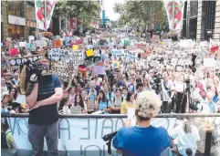  ?? Picture: GETTY IMAGES ?? POLITICS CLASS: Singer Montaigne addresses students as they gather to demand the Government take action on climate change at Martin Place in Sydney yesterday.