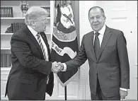  ?? AP/ Russian Foreign Ministry ?? President Donald Trump greets Russian Foreign Minister Sergey Lavrov in the Oval Office of the White House on Wednesday.