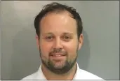  ?? WASHINGTON COUNTY DETENTION CENTER VIA AP ?? On Wednesday in Fayettevil­le, Ark., Josh Duggar was sentenced to 12 1/2 years in prison after being convicted of receiving and possessing child pornograph­y.