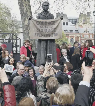  ??  ?? 0 The statue of suffragist Millicent Fawcett was designed by artist Gillian Wearing, right centre, with London mayor Sadiq Khan and activist Caroline Criado-perez