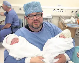  ??  ?? DADDY’S GIRLS Colin Rodger with his twin baby daughters Rowan and Isla three years ago