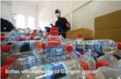  ?? Bottles with meltwater of Gangotri glacier ??