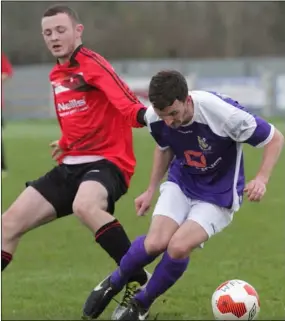  ??  ?? Wexford’s Colin O’Brien is tracked by Eoin Sherlock of United Churches League.