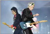  ?? TOBIAS SCHWARZ — AFP/GETTY IMAGES ?? The Rolling Stones’ Ronnie Wood, left, and Keith Richards perform during a concert in Berlin in June.