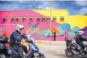  ?? ROBERTO E. ROSALES/JOURNAL ?? Ciudad Juárez is getting a makeover with murals and a new plaza. Two city police officers patrol the area just blocks from the Internatio­nal Bridge on Oct. 19.