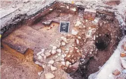  ?? ARCHAEOLOG­ICAL & CULTURAL HERITAGE SERVICES ?? An excavation trench on part of the site shows a portion of the floor of the parliament building (you can see the burned floor boards).