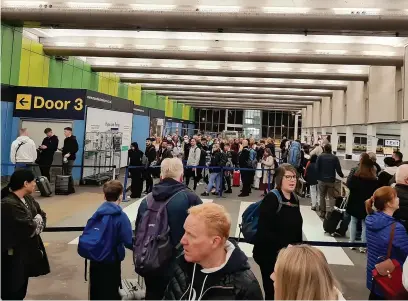  ?? ?? Passengers at Manchester Airport have been met with long queues