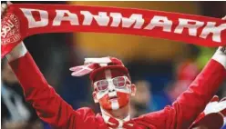  ?? Agence France-presse ?? A supporter of Denmark looks dejected after their loss.