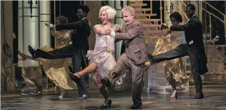  ?? DAVID COOPER/SHAW FESTIVAL ?? Top, Michael Therriault stars as Ebenezer Scrooge in A Christmas Carol. Right, Vanessa Sears’ character Frieda Flamm dances with Therriault’s Otto Kringelein and the cast of Grand Hotel.