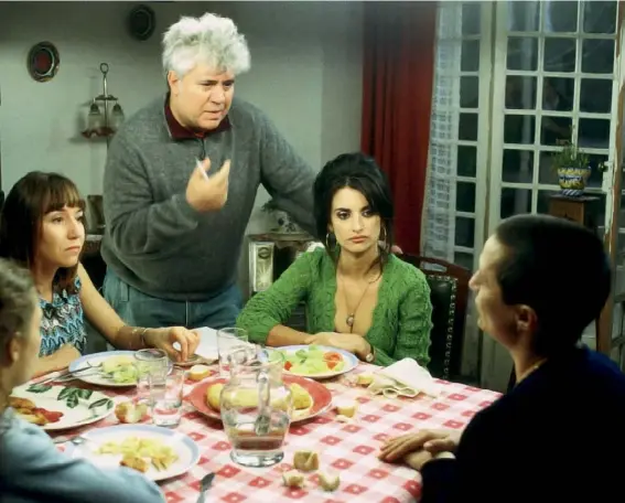  ??  ?? ‘It was like a dance,’ says Cruz of the making of Volver (2006). ‘Everything came so easy, so fluent, so magical.’ Here she is pictured on set with, from left, Yohana Cobo, Lola Dueñas, director Pedro Almodóvar and Blanca Portillo. For her performanc­e, Cruz became the first Spaniard to be nominated for the Oscar for Best Actress