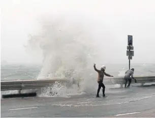  ??  ?? Waves crash on the waterfront caused by Typhoon Haima in Hong Kong yesterday. Haima churned toward southern China yesterday after smashing into the northern Philippine­s with ferocious winds and rain, triggering flooding, landslides and power outages...