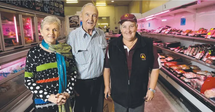  ?? Picture: STEWART McLEAN ?? Byrnes Meats owners D'Arcy and Raylee Byrnes with long term employee Karen Moffatt are celebratin­g 55 years in business.
