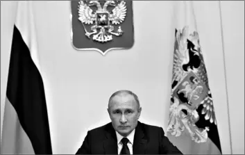  ?? ALEXEI NIKOLSKY, SPUTNIK, KREMLIN POOL PHOTO VIA AP ?? Russian President Vladimir Putin attends a meeting via video conference at the Novo-Ogaryovo residence outside Moscow, Russia, on Wednesday.