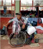  ?? AP ?? Guatemalan migrant Irma Reyes, 78, sits in her wheelchair at a sports club in Matias Romero, Mexico, with other migrants taking part in the annual Stations of the Cross journey.